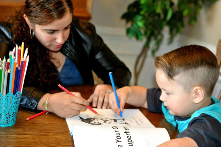 Cynthia Cordero coloring with a child