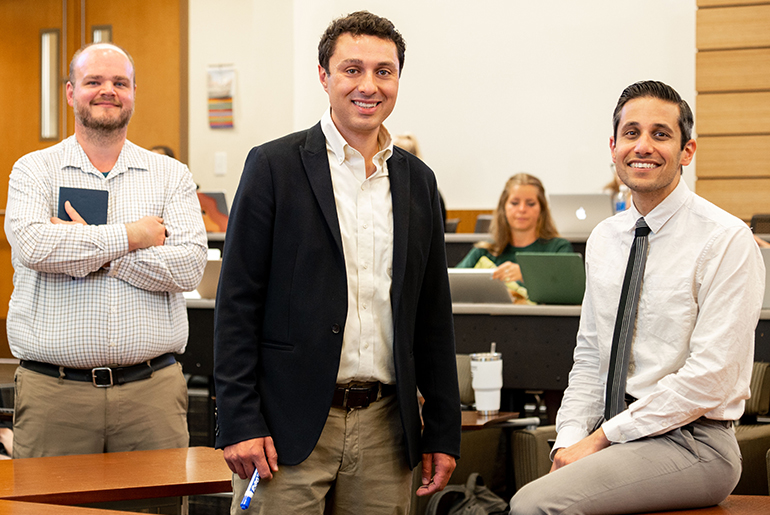 Three honors program professors posing