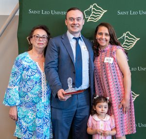 Roaring Onward recipient Benjamin Larison &rsquo;14 with his family.