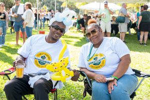 Two people attending the Lions Rally, part of 2022 Homecoming & Family Weekend.